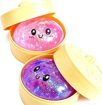 Two glitter-filled squishy dumplings in mini steamer basket packaging, an office desk squishy toy pick